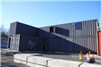 Black corrugated metal Training Facility Exterior